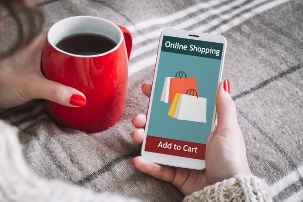pinnaclecart ecommerce features shopping cart woman shopping from phone with red coffee mug in hand online shopping
